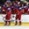 GRAND FORKS, NORTH DAKOTA - APRIL 18: Russia's Alexei Lipanov #10, Mikhail Kozlov #15, Veniamin Baranov #7, and Pavel Dyomin #8 high fives the bench after a first period goal against Latvia during preliminary round action at the 2016 IIHF Ice Hockey U18 World Championship. (Photo by Matt Zambonin/HHOF-IIHF Images)

